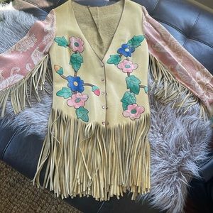 Vintage fringe leather jacket with jewel snaps and tapestry arms.